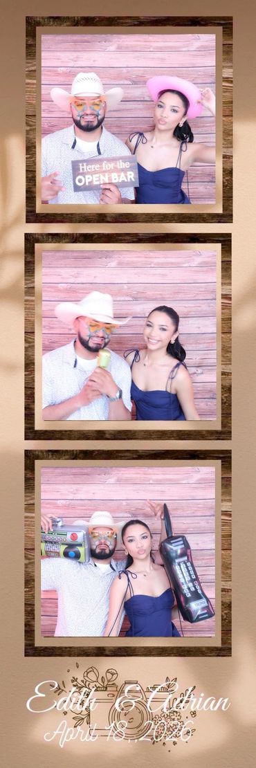 Couple in fun hats posing with props at a celebration.