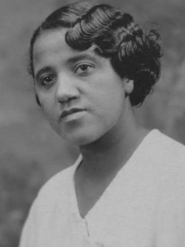 Black and white portrait of a woman with vintage hairstyle.