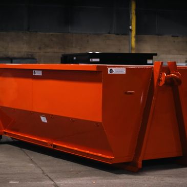 Orange steel roll-off container built by Elite Containers in Waterbury, CT