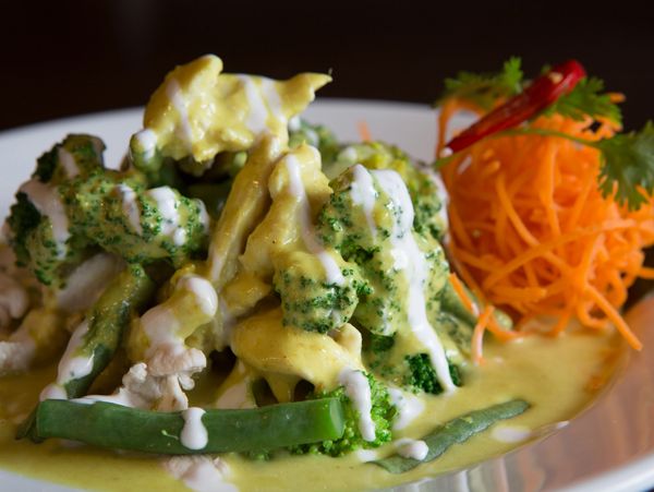 Creamy green curry with vegetables.