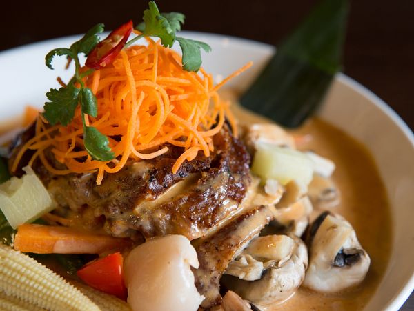 Thai curry with shredded carrots.
