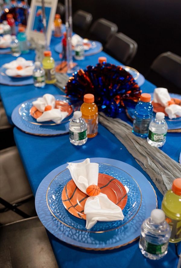 Basketball-themed table setting with blue and orange accents.