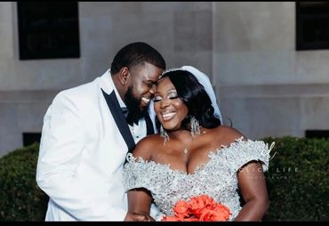 Happy couple sharing a joyful moment on their wedding day.