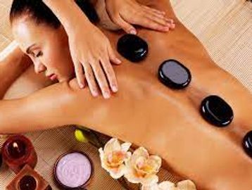 A lady receiving a Hot Stone Massage