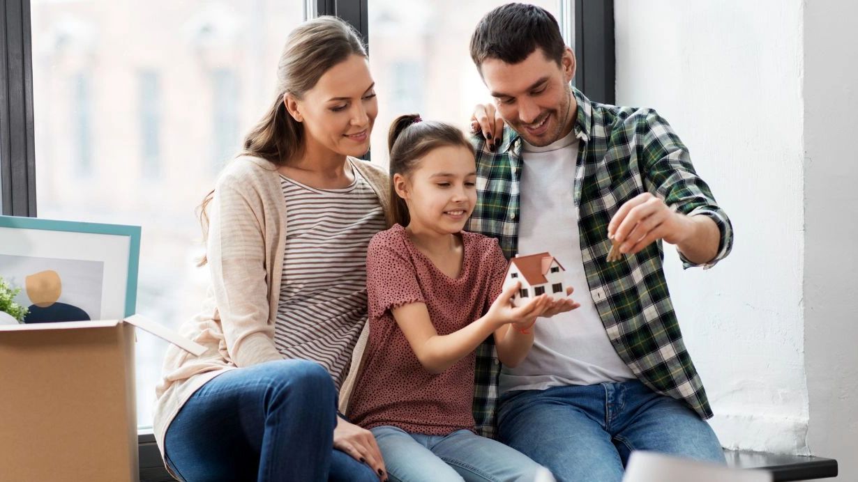 “Man and Van team loading furniture into a van for a home removal in Manchester”