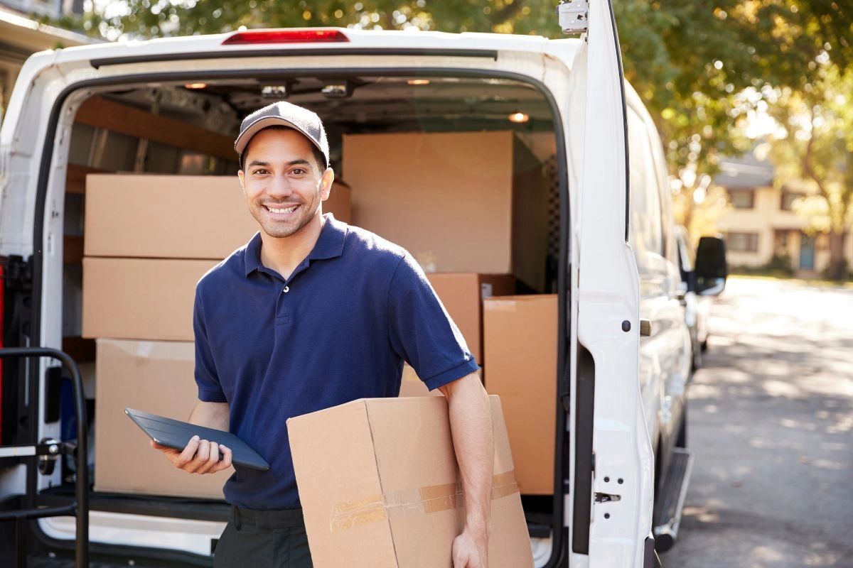 Man and van hire loading boxes in Manchester home