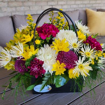 Black tote basket flower arrangement