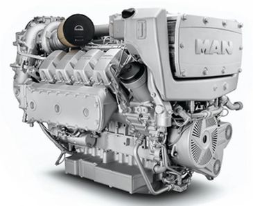 A large, industrial MAN diesel engine painted in silver.