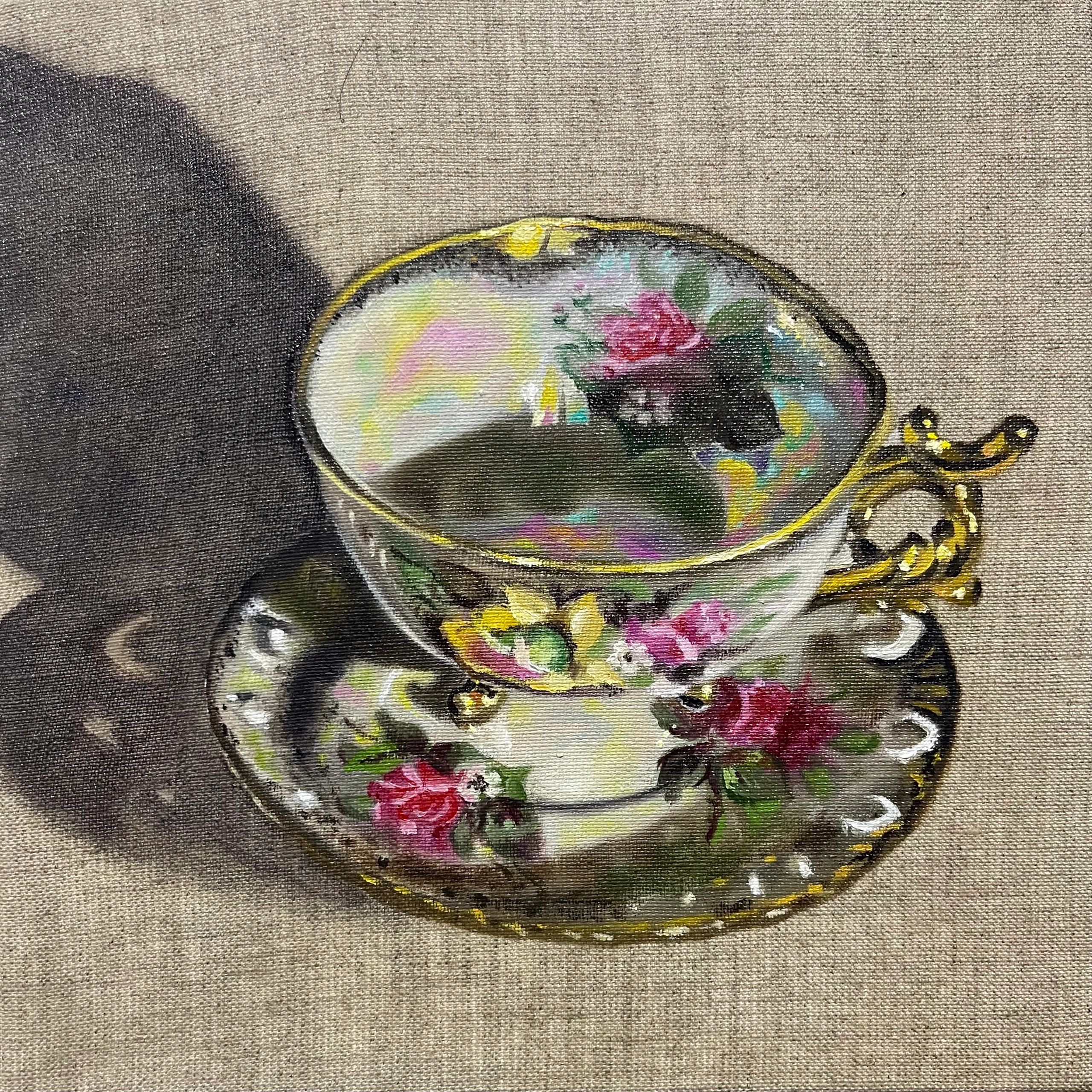 a teacup painted on linen, with lustre and gold details