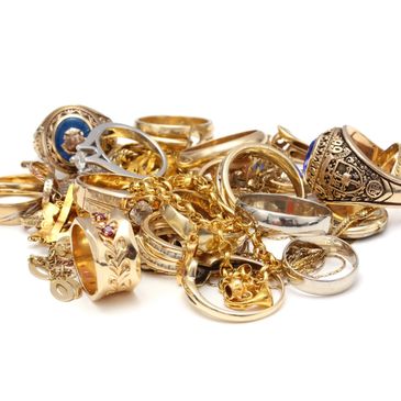 A group of gold scrap jewelry including several rings  some chain.