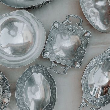 Silver dishes and trays and bowls