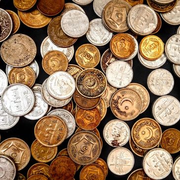 A group of mixed foreign coins.