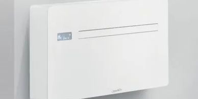 Modern white wall-mounted heater with display.