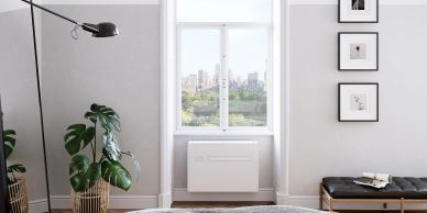 Cozy room with a large window and city view.