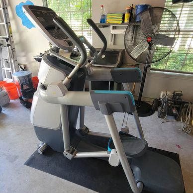 Precor AMT 835 motion trainer in a room 
