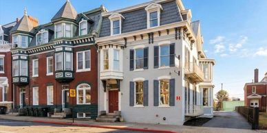 Historic row houses under a blue sky.