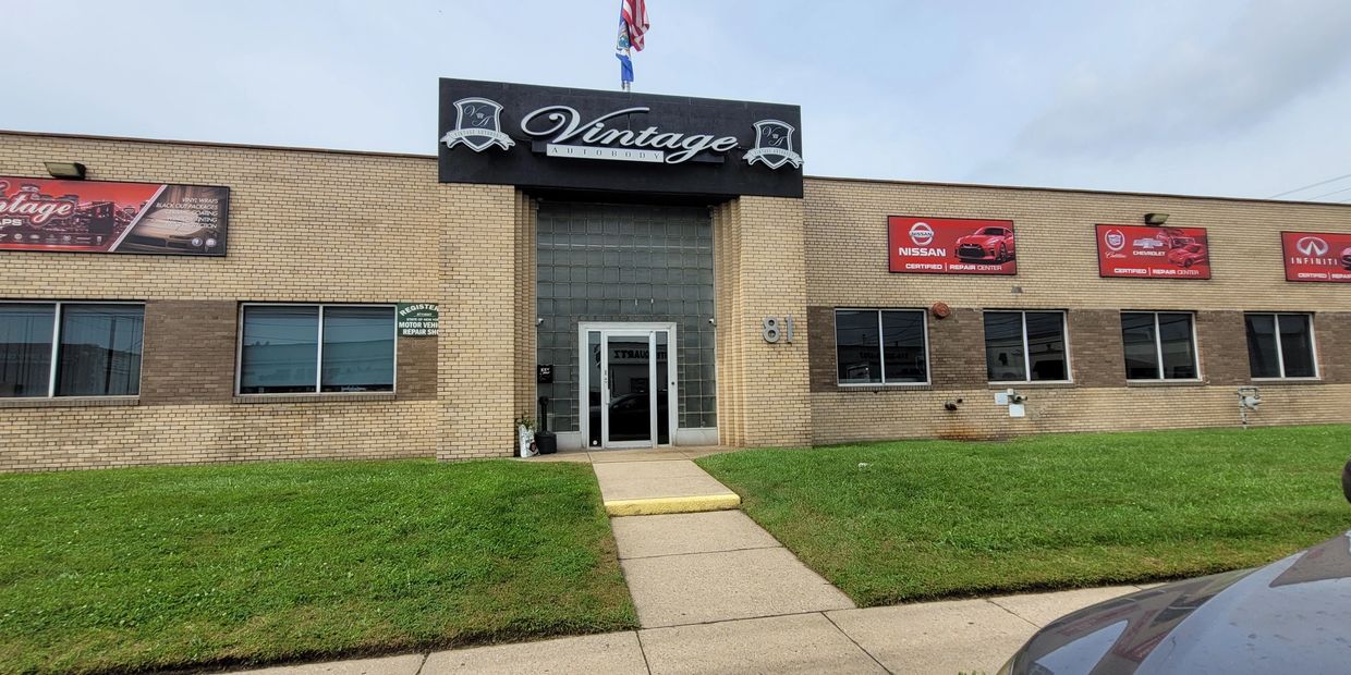 Front view of Vintage Autobody repair shop with branded signage.