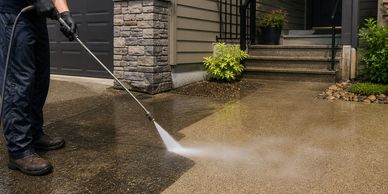 
Power washing services in Vernon BC cleaning driveway and exterior concrete surface