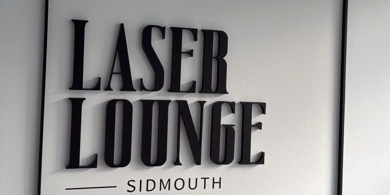 Laser Lounge Sidmouth sign on wall