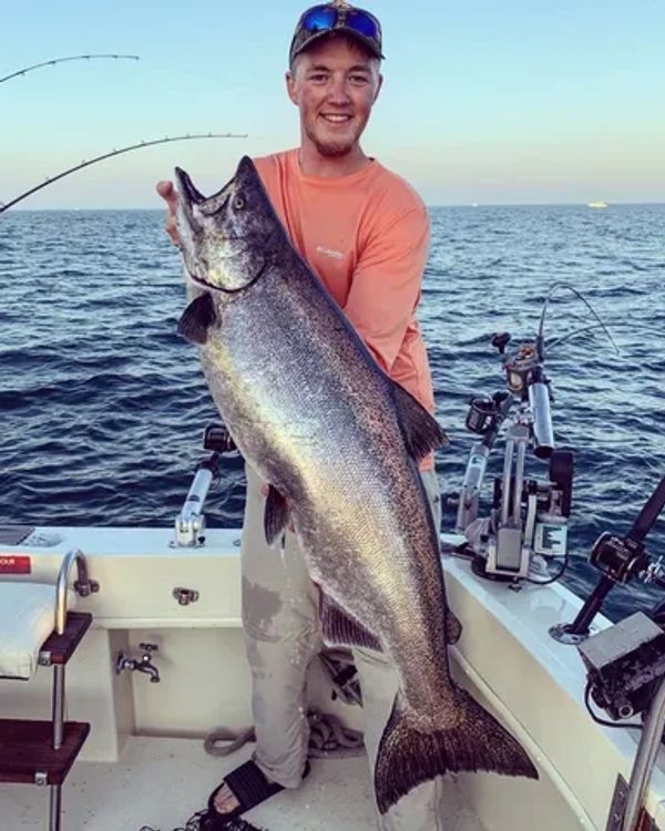 Captain Dan, with a nice King Salmon with running fishing charters in Port Washington, WI. 