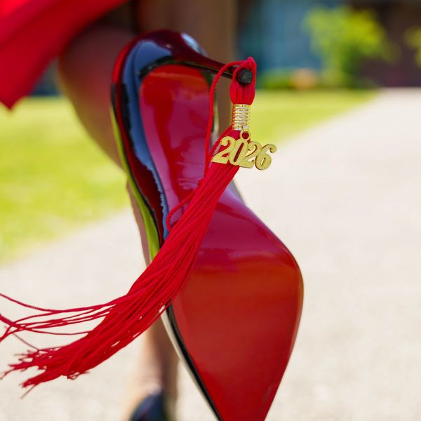 Red high heel shoe with a 2026 graduation tassel attached.