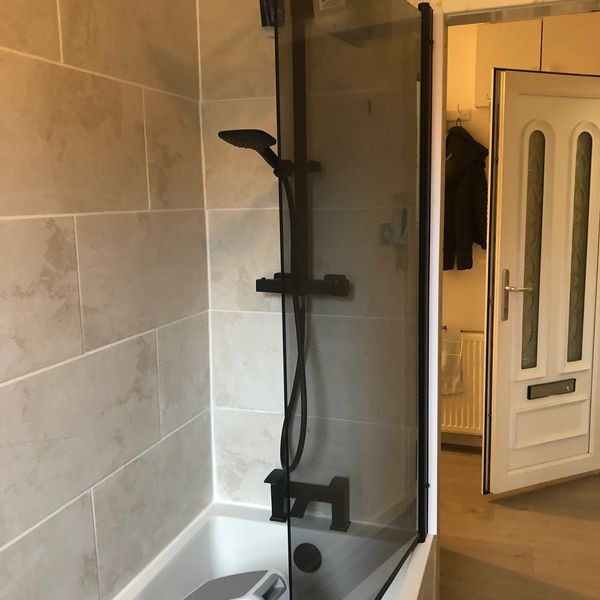 NEW BATH SHOWER AND TILLING DONE BY OUR PROFESSIONAL HANDYMAN IN BEARSDEN