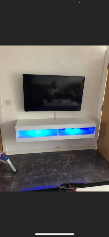 Tv wall mounted with floating unit and trunking 