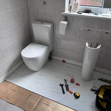  preparation for laying vinyl flooring in a bathroom. removing bathroom toilet pan and sink