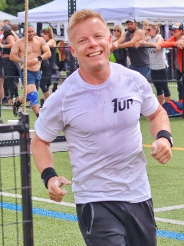 CrossFit Athlete, working out, doing exercise in a competition   