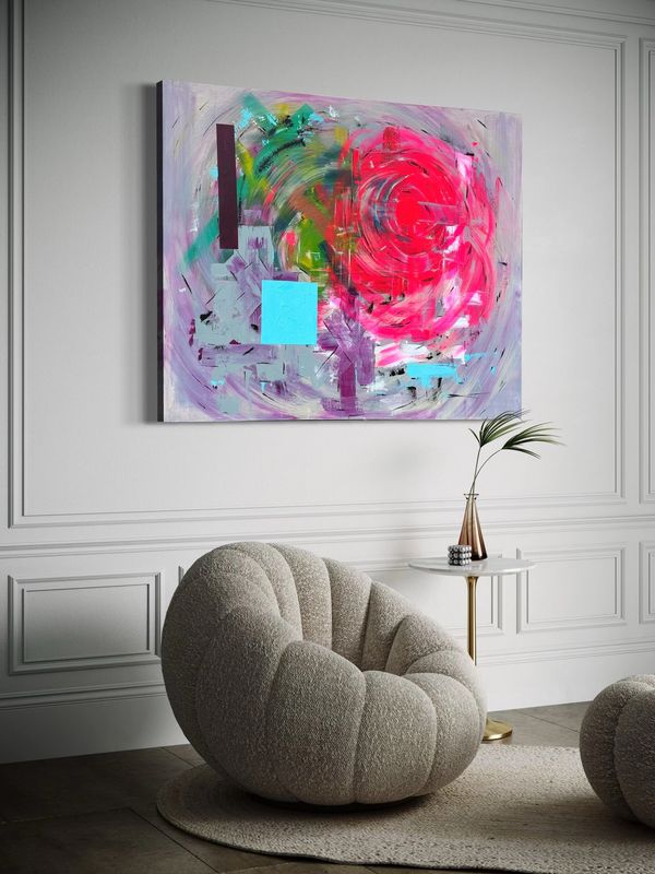 Modern art above a comfy textured chair and a small side table.