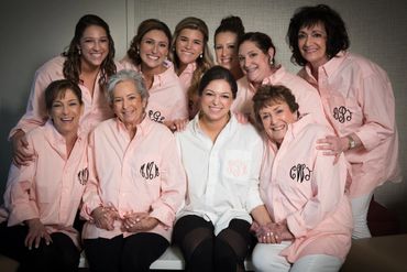 photo of bride and family in collared monogrammed tops