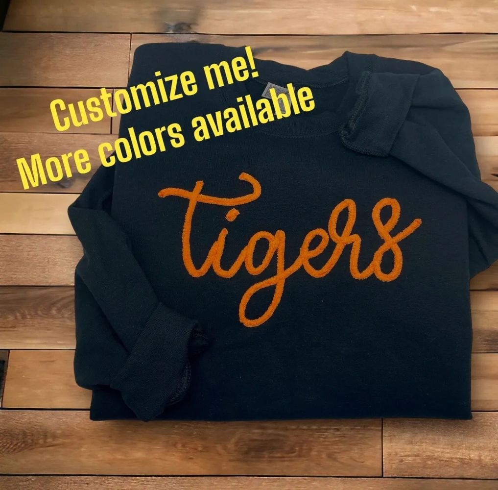 Black sweatshirt with tigers in orange chenille yarn