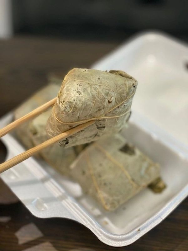 chicken, sticky rice wrapped in a lotus leaf