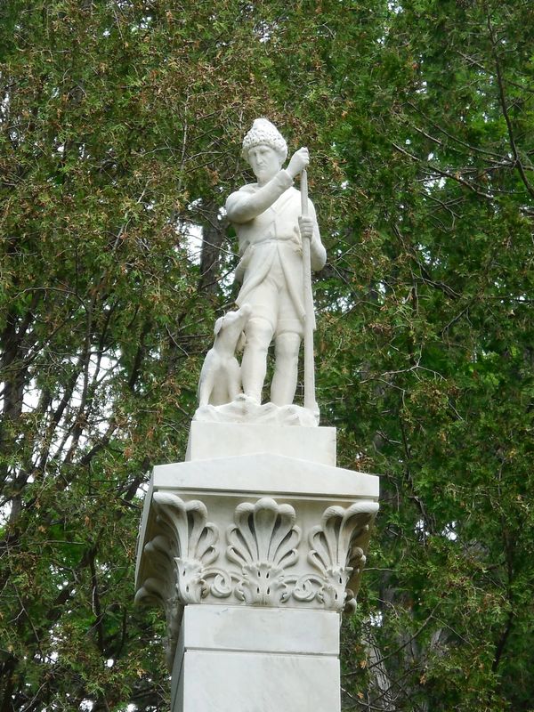 Statue of Leatherstocking and his dog Hector at top of Cooper Monument after cleaning 