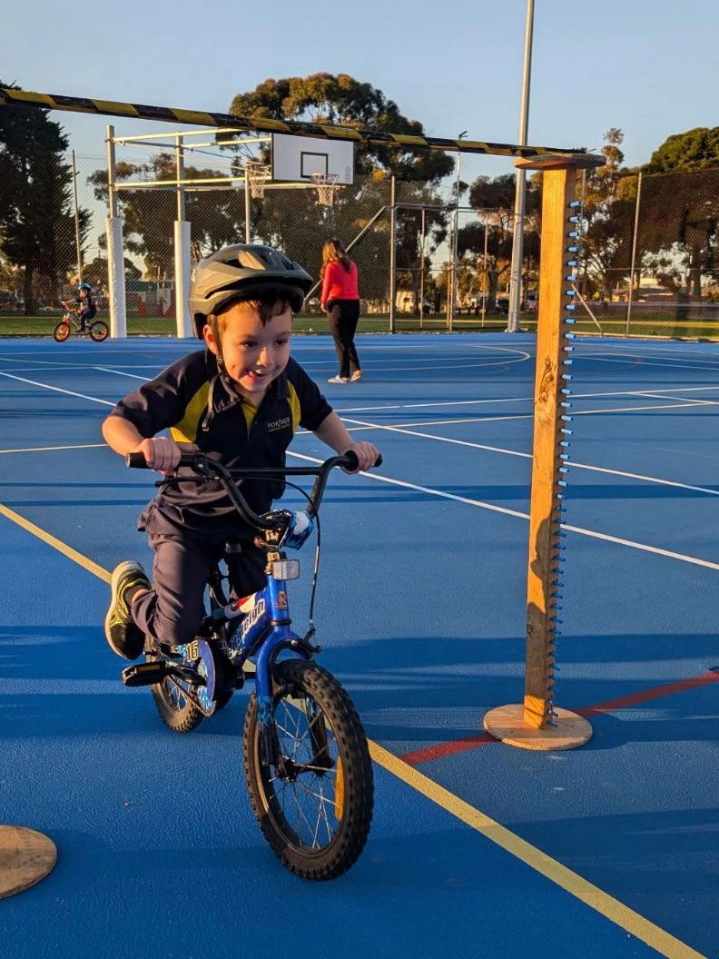 Charlie practicing the bike limbo obstacle
