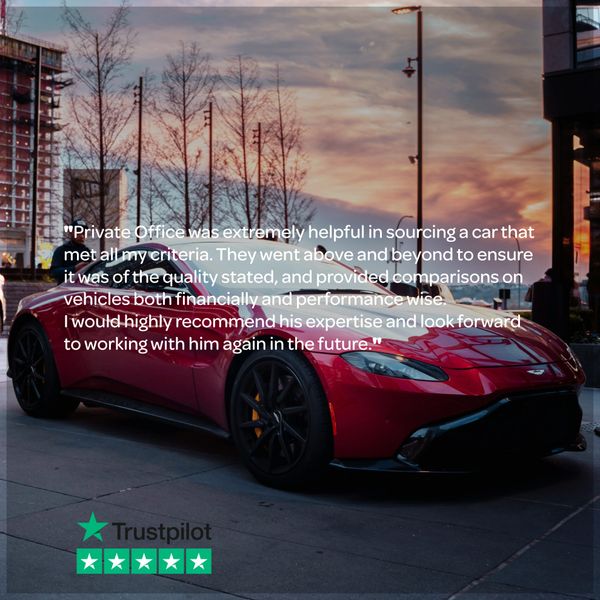 Red luxury sports car parked at sunset in urban setting with customer review text overlay.