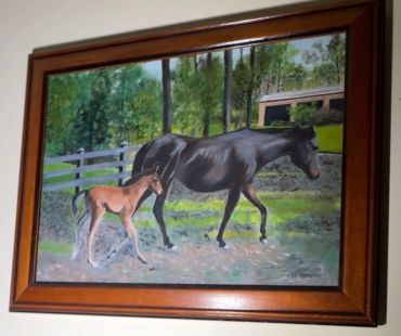 Painting of a horse and foal in a pasture.