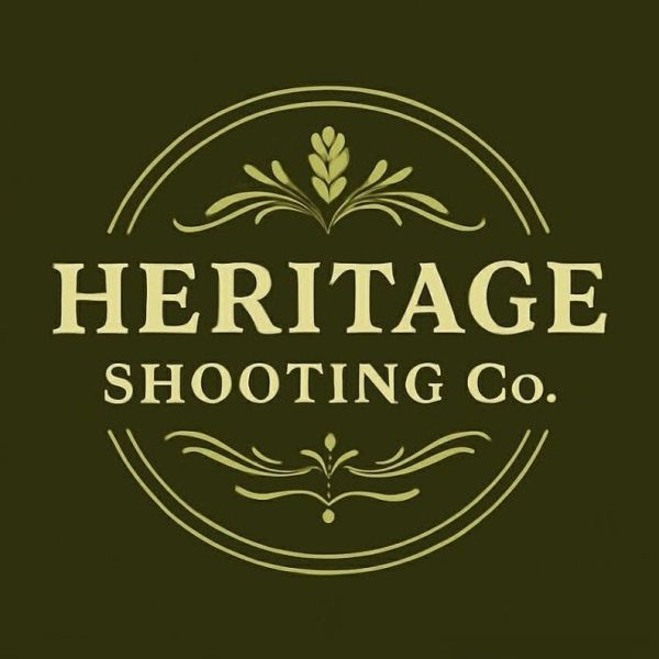 Logo of Heritage Shooting Company with vintage ornamental design.