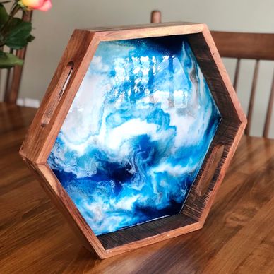 A resin and wood octagon tray in blues and whites