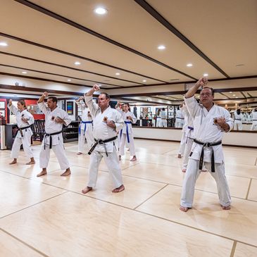 group of older men training in karate