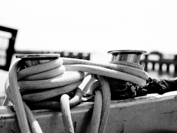 Hands-On Action: Coiling ropes, tying knots, or securing yacht fenders.