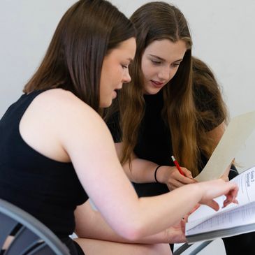 Acting student working with a tutor at her drama class.