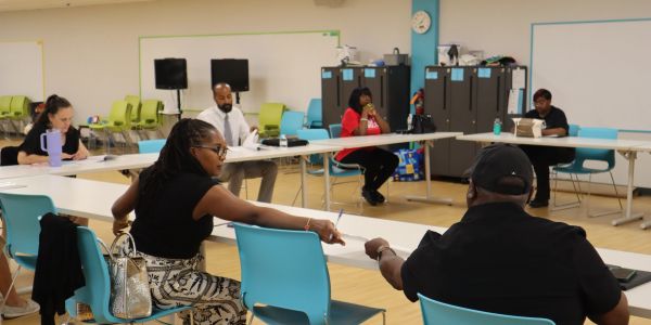 Group meeting or class in a classroom setting.