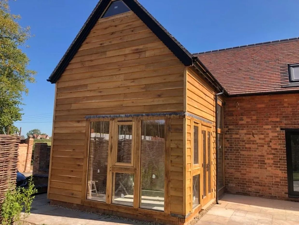 Sunroom project with timber clad extension.