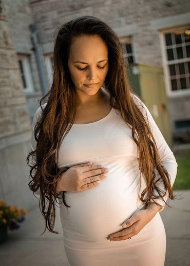 pregnant woman with hands on belly