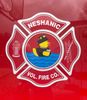 Logo of Heshanic Volunteer Fire Company with firefighter helmet and axe.