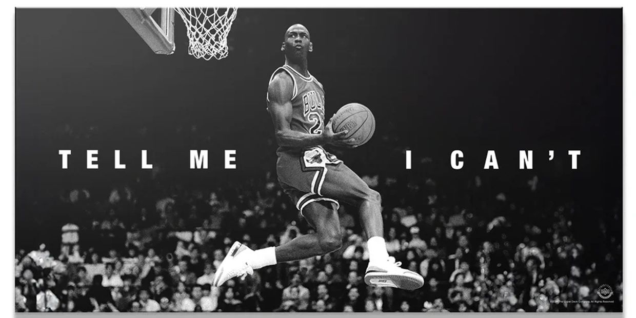 Michael Jordan mid-air dunk with the phrase 'Tell me I can't'.