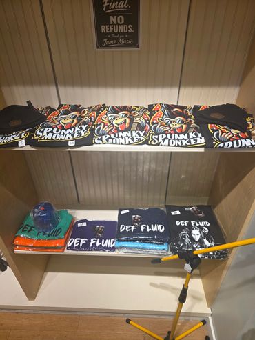 Display of colorful t-shirts in a shop.