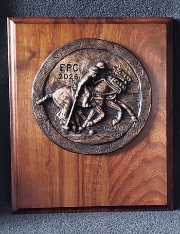 Bronze polo trophy plaques created for El Dorado Polo Club on Walnut wood backing.