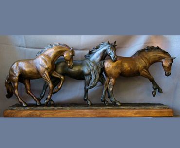 Three horses galloping bronze sculpture by Kim Corpany titled "Running Free"